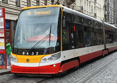 City Tram at a station where are rail pads have been laid under track.