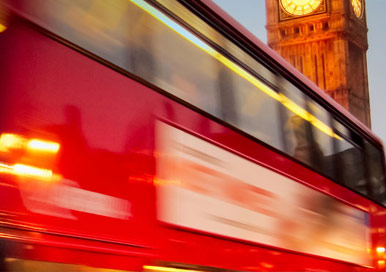 Moving London bus highlighting our connection to supply flooring inside this type of transport.