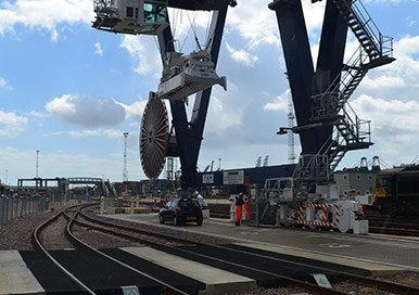 Huge Rail Cranes lifting heavy rail equipment.