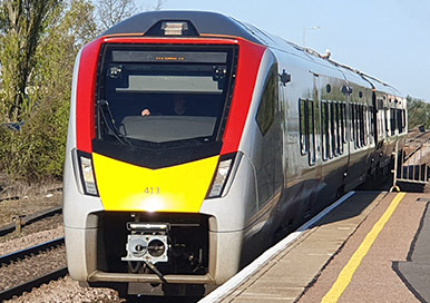 Large passenger train at a station platform